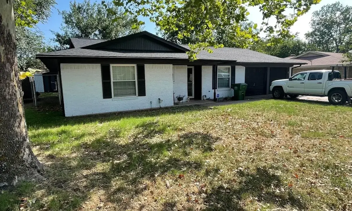 Professional roofing crew working on a residential roof in La Homa